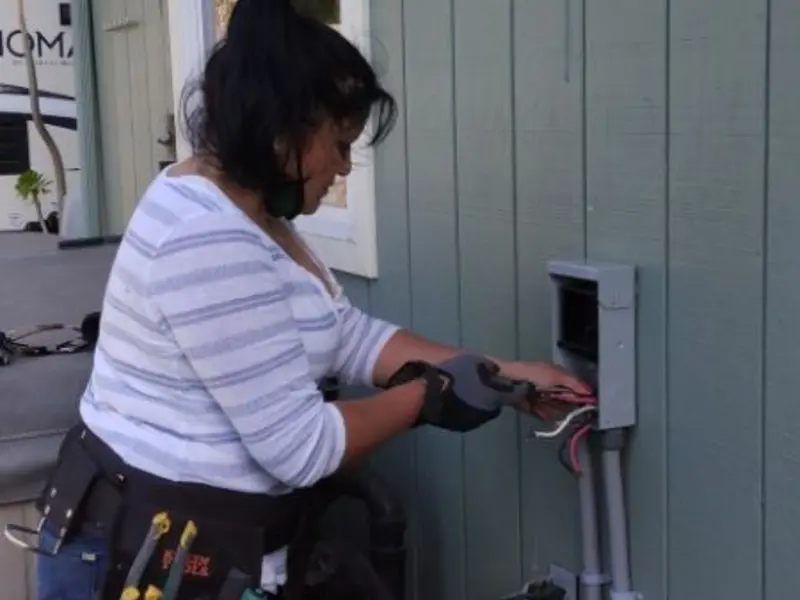 Licensed electrician wiring an exterior subpanel in Riverview