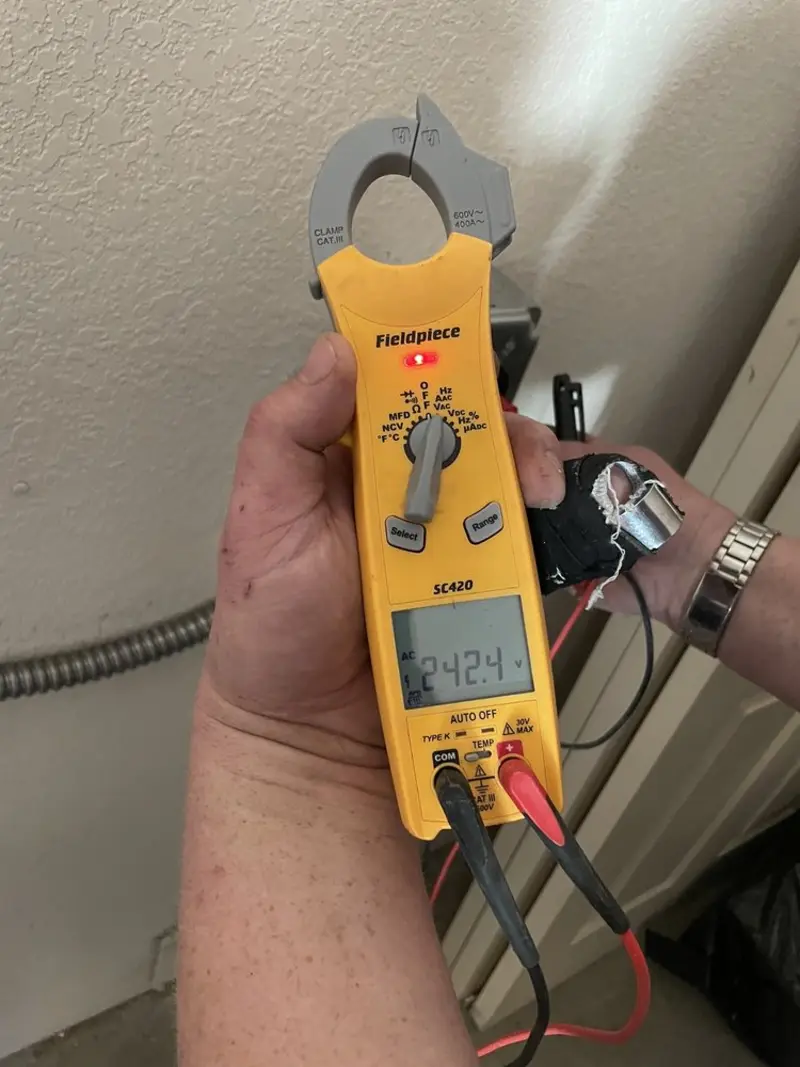 Voltage testing with clamp meter during Generator Installation in Riverview